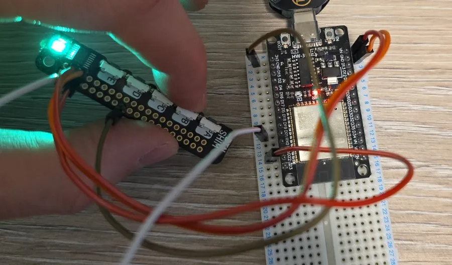 Photo of the button shim with button B pressed and LED showing green