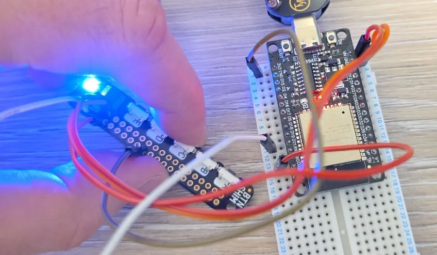 Photo of the button shim with button C pressed and LED showing blue