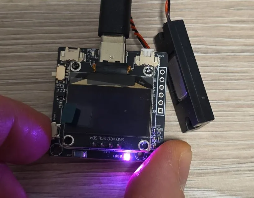 Photo of boot button press causing LED to turn on