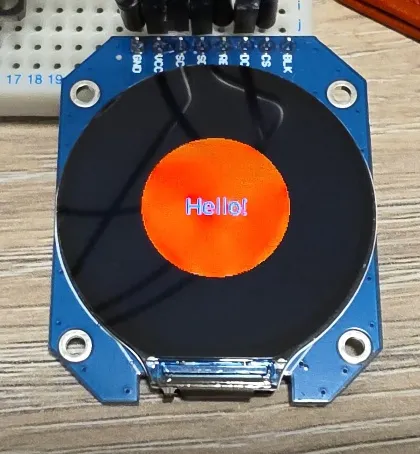 Round Screen Showing Red Circle and Hello