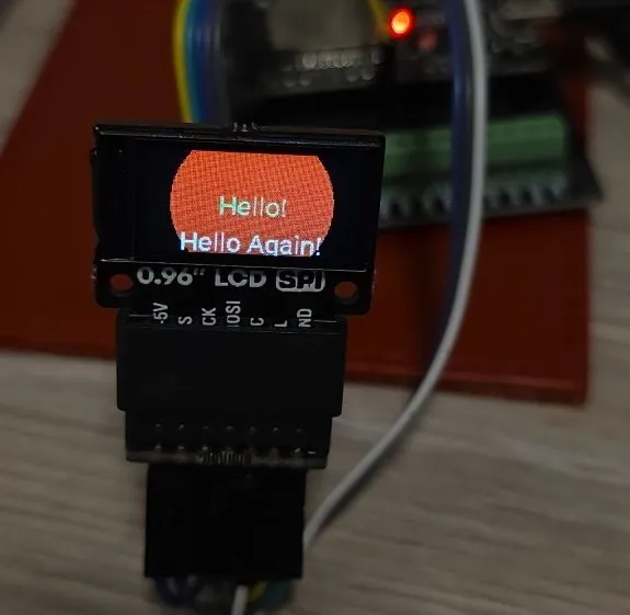 ST7735 based 0.96 inch display showing Red Circle and Hello